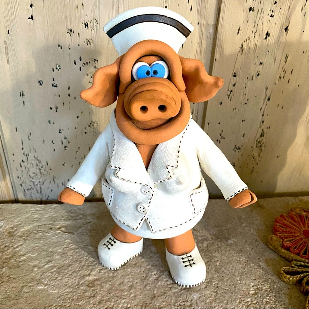 Vintage Pottery pig nurse by Grant. A potter in the 1980s.